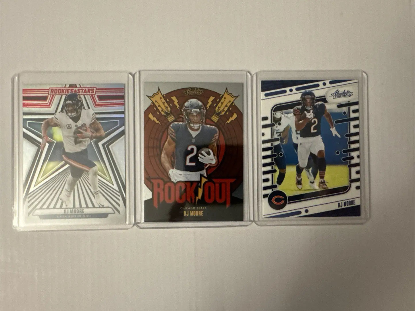 Chicago Bears trading cards featuring William Perry and Devin Hester in protective cases