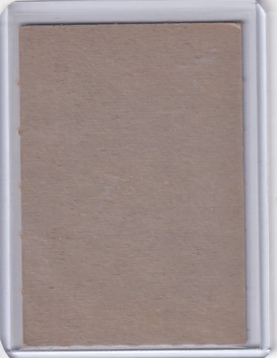 Blank back of 1961 Post Baseball Jack Brandt Baltimore Orioles trading card in plastic sleeve