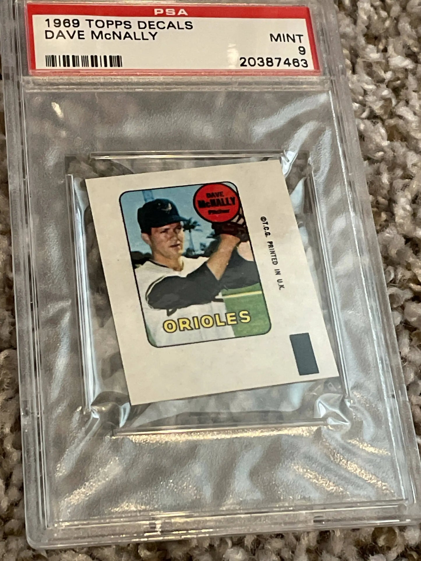 Graded trading card of Dave McNally from 1969 Topps Decals in protective holder