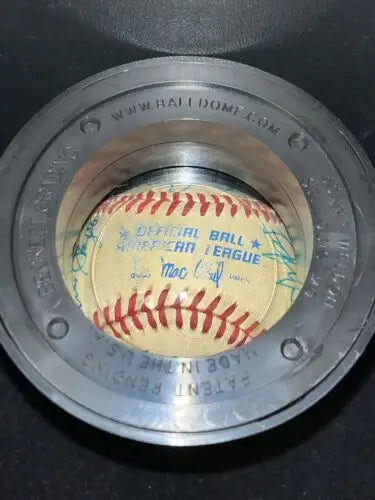 Baseball in a display case of the 1982 Cracker Jack game signed baseball with DiMaggio auto