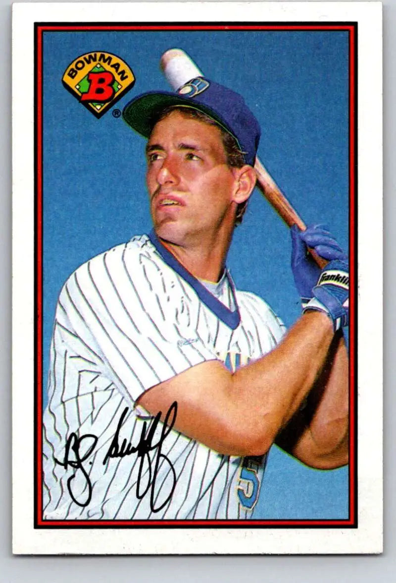 Baseball player in pinstriped uniform holding bat for Milwaukee Brewers baseball card