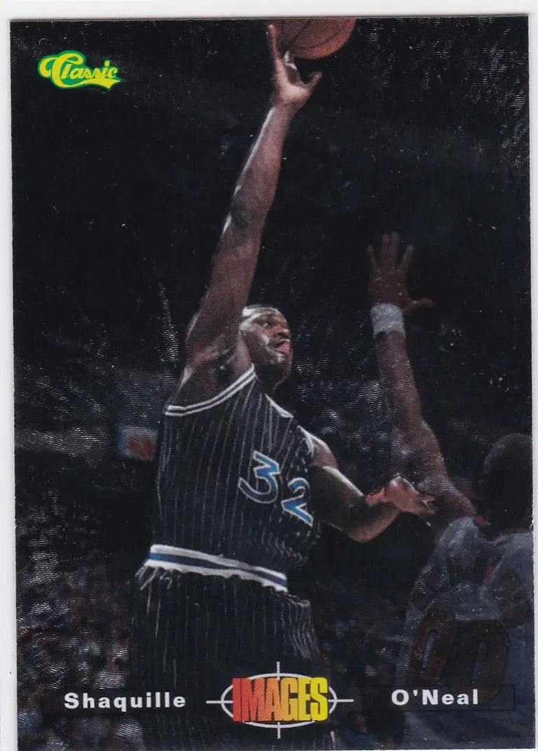 Basketball player in dark striped jersey number 32 shooting ball, 1995 Classic Images Orlando Magic