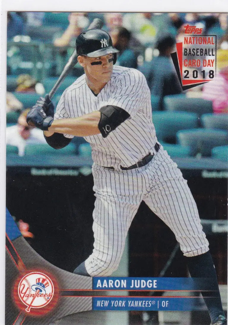 Baseball player in New York Yankees pinstripes at bat for Topps National Baseball Card Day