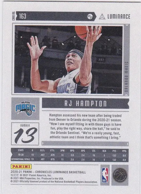 Basketball trading card of RJ Hampton RC Orlando Magic in white jersey reaching for the ball