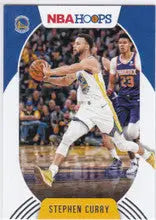 Stephen Curry in white and blue uniform dribbling ball for Golden State Warriors