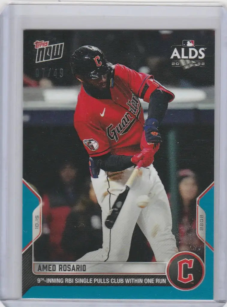 Baseball card of Amed Rosario from Cleveland Guardians in red jersey swinging bat