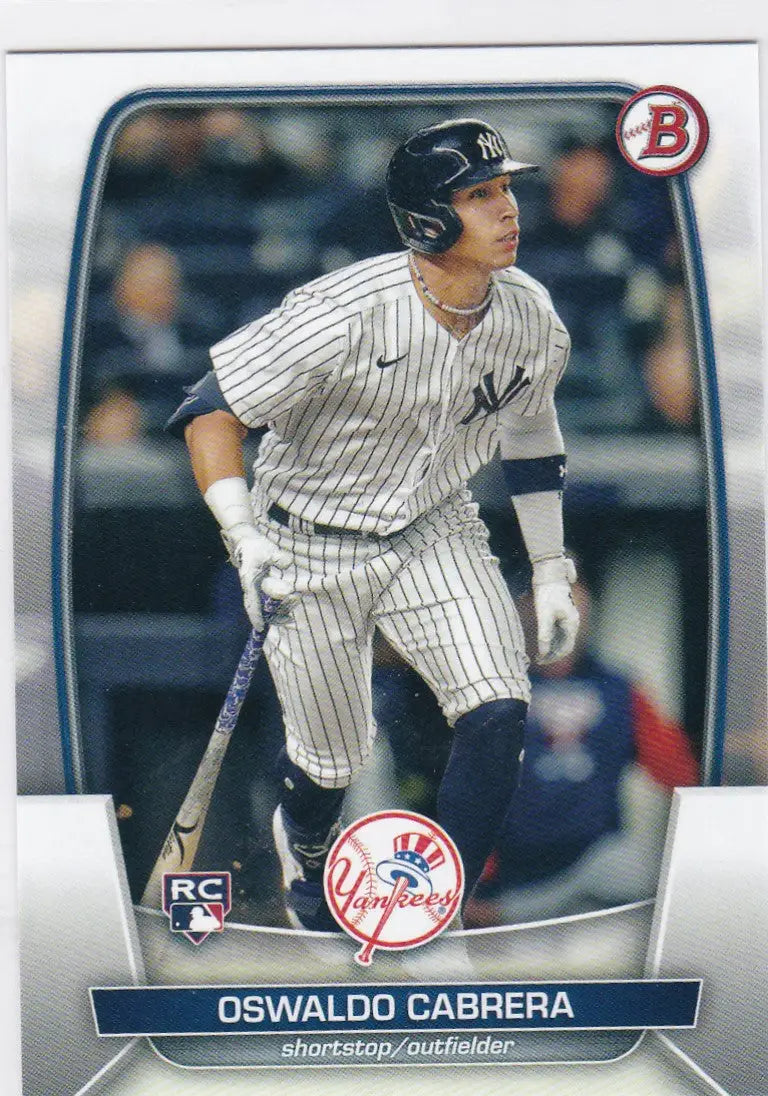Baseball card of Oswaldo Cabrera in New York Yankees pinstripe uniform at bat