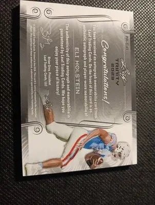 2023 Leaf Trinity - Patch Auto Eli Holstein #PA-EH1/99. NRMT+ - Football Card Single