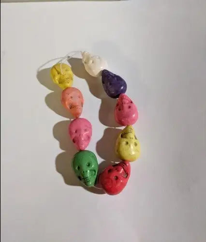 Colorful ceramic skull large beads on a multi-colored strand bracelet for a bold accessory