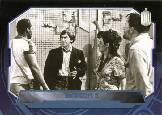 Black and white image of four people in conversation on a Blue Foil Parallel Card