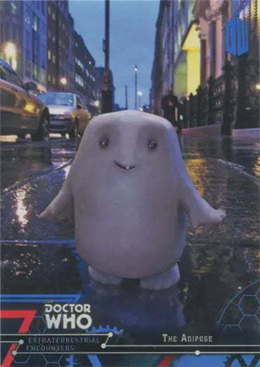 Cute white blob-like creature on a wet street featured in Doctor Who Blue Parallel Chase Card