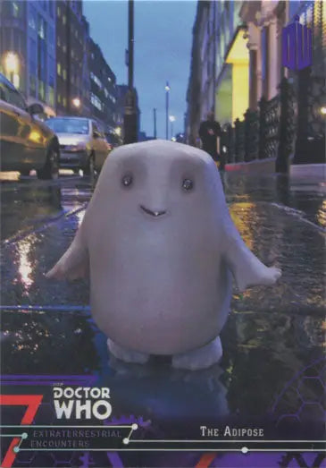 Cute ghostly white creature on wet city street featured in Doctor Who Purple Parallel Chase Card