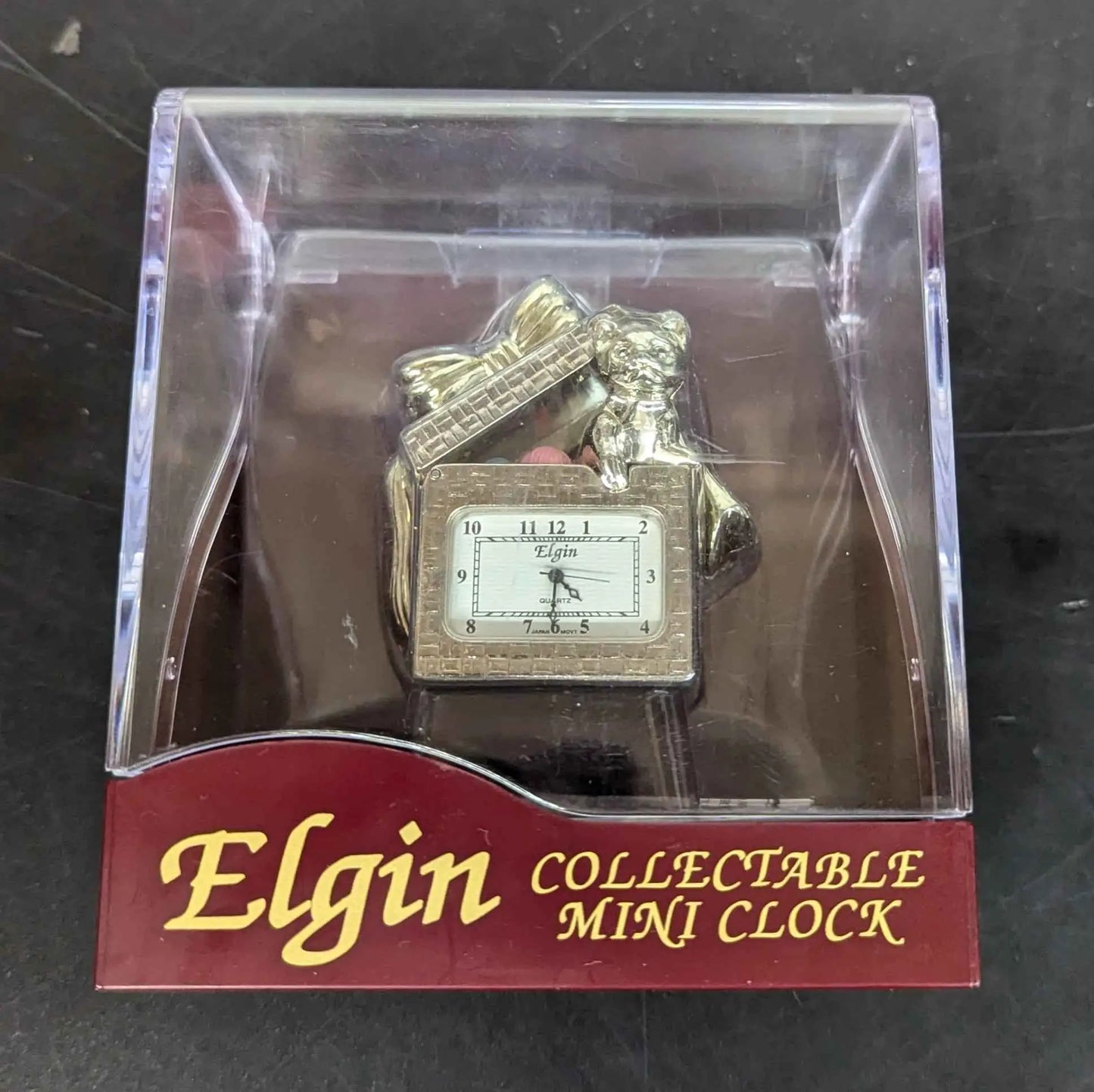 Gold-toned Elgin Collectible Mini Clock in retail packaging for collectors