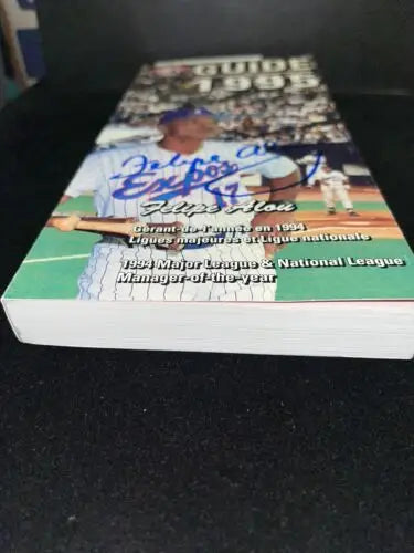 FELIPE ALOU Signed 1995 Montreal Expos Media Guide Auto JSA for collectors