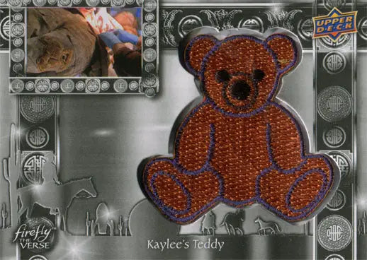 Embroidered patch of a brown teddy bear on Firefly the Verse Trading Card F-35 Kaylees Teddy