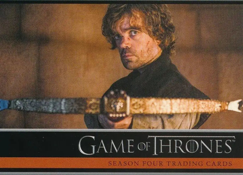 Man with curly hair in a dark shirt holding a crossbow on Game of Thrones promo card
