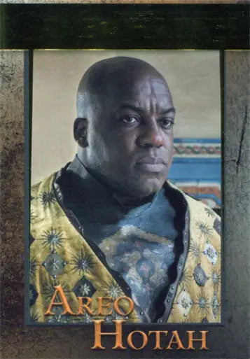 Bald man in patterned yellow and blue robe on Game of Thrones gold parallel trading card