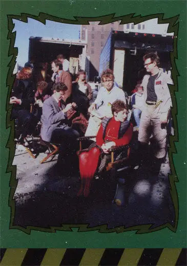 Group photo outdoors featuring a person in red from Ghostbusters Behind the Scenes B7 Foil Parallel Chase Card