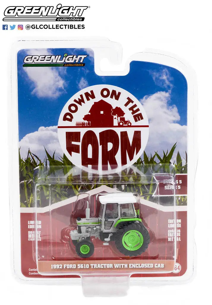 Green and white toy tractor w enclosed cab in packaging for Farm Series 5