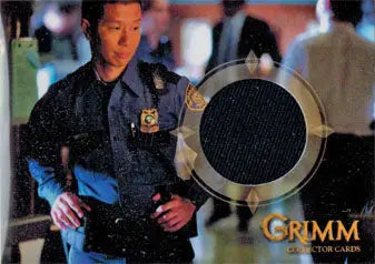 Police officer in dark uniform badge, featured in Reggie Lee trading cards
