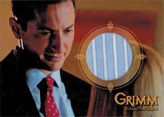 Man in a dark suit and red tie by a circular window for Sasha Roiz as Captain Renard trading card