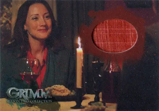 Bree Turner as Rosalee smiling at a candlelit table in Grimm Season 2 Trading Cards