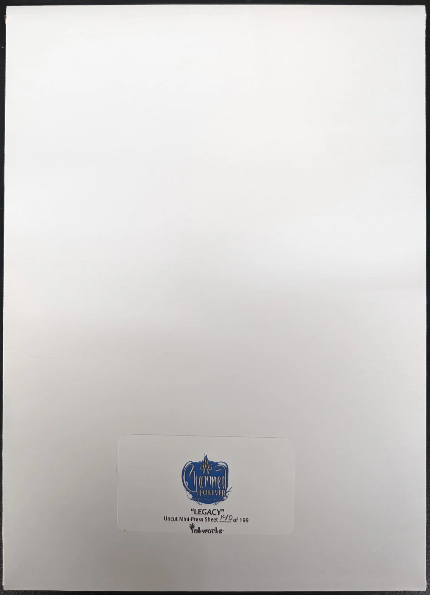 Blue circular logo with text beneath on Inkworks 2007 Charmed Forever Legacy product