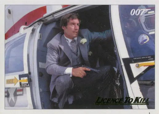 Man in gray suit exits helicopter with 007 in background on gold parallel chase card
