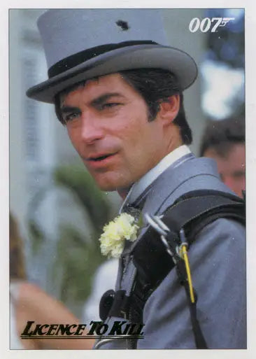 Man in gray suit and hat with yellow boutonniere on James Bond 007 gold parallel chase card