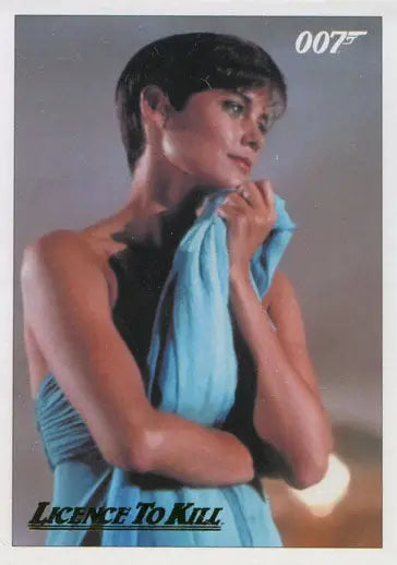 Woman in light blue dress poses elegantly for James Bond 007 Gold Parallel Chase Card