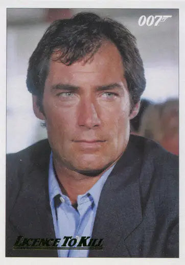 Portrait of a man in a suit with 007 logo on James Bond 007 Classics Gold Parallel Chase Card