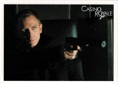 Man in dark suit aiming handgun on James Bond Archives 2014 promo card for collectors