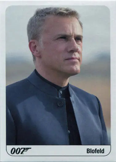 Middle-aged man in suit highlights James Bond Archives Trading Cards collection