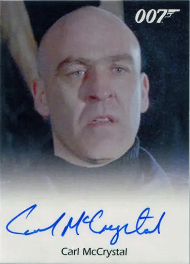 Close-up of a bald man with blue eyes on the James Bond autograph card