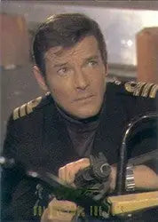 Man in a dark naval uniform with gold epaulettes on a James Bond trading card promo card