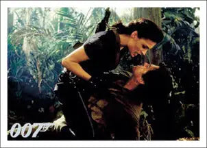 Couple in passionate embrace surrounded by tropical foliage on James Bond trading card