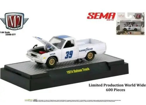 Miniature model of a white 1974 Datsun Truck Goodyear on display from M2 Machines SEMA
