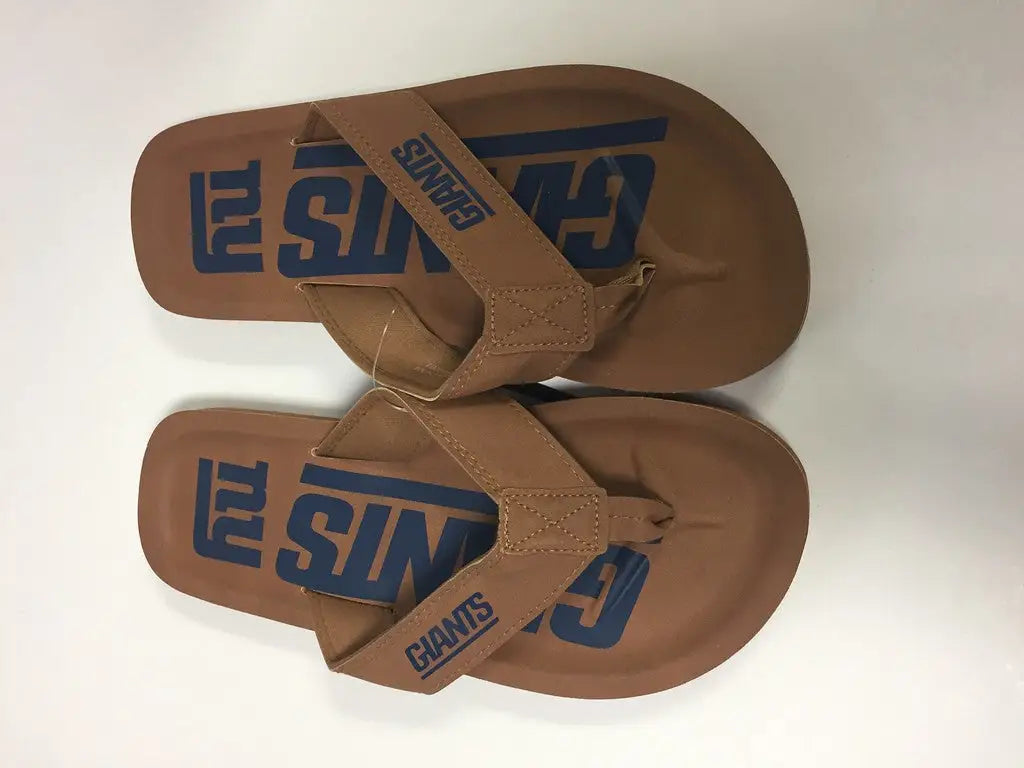 Brown flip-flops with blue Surf branding and New York Giants team logo display