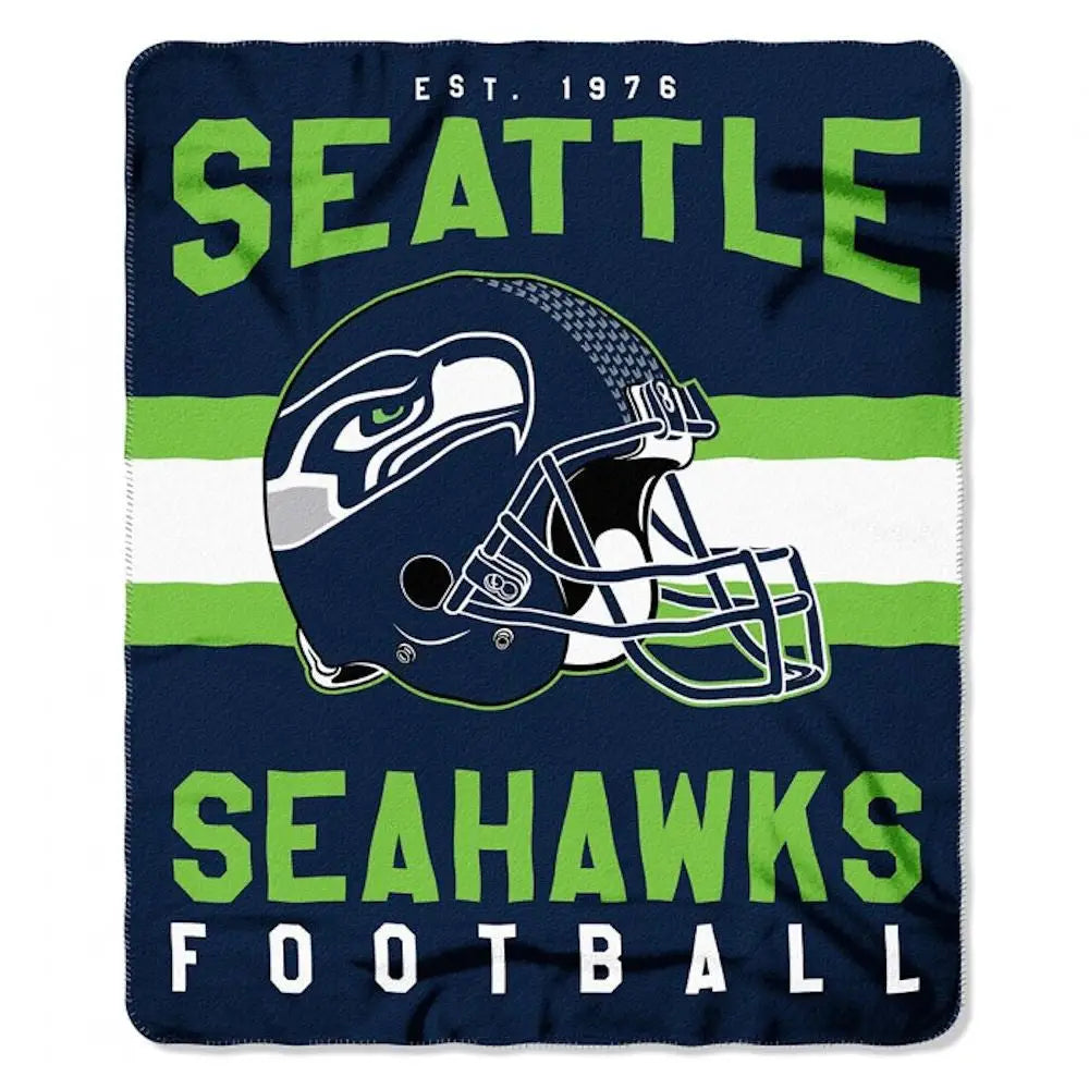 Seattle Seahawks football helmet on an officially licensed fleece throw blanket