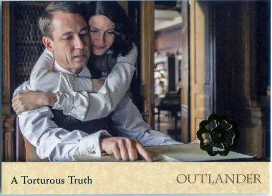 A couple embracing in a period setting on Outlander Season 2 Gold Jacobite Seal Parallel