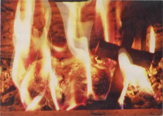 Roaring fire with bright flames showcasing the Paranormal Activity Evil Chase Card