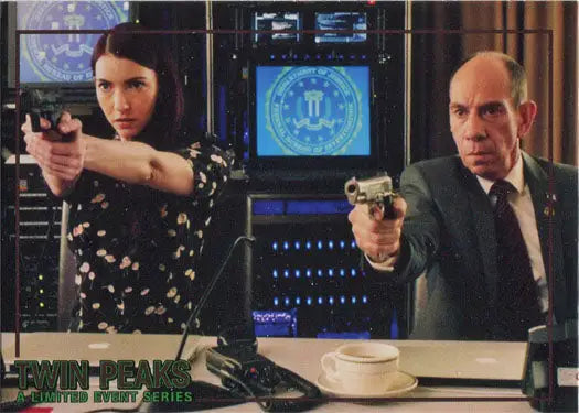 Two people aiming handguns in an office setting on Rittenhouse 2019 trading card