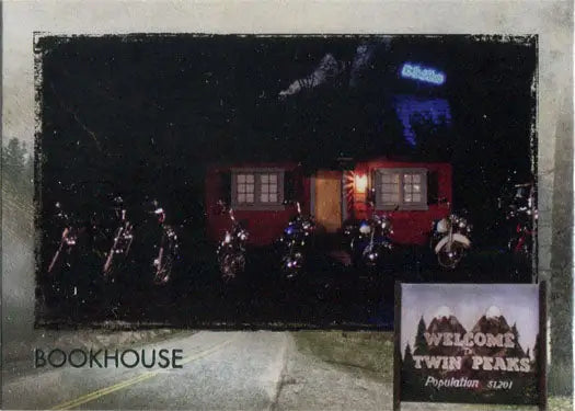 Red trailer with illuminated windows at night from Twin Peaks trading cards