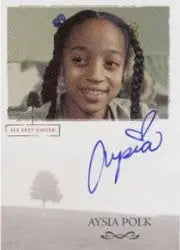 Smiling young girl with braided hair showcases Aysia Polk Autograph Card from Six Feet Under