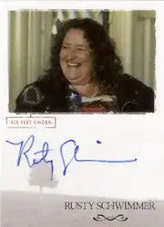 Autographed Rusty Schwimmer trading card featuring a smiling woman with curly hair