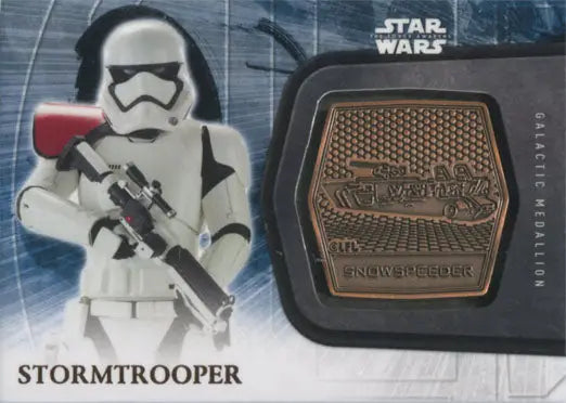 Stormtrooper action figure with blaster next to Star Wars medallion and trading cards