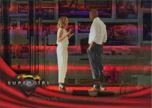 Two people on a red-lit stage with SUPERGIRL text for Rainbow Foil Board Card 07