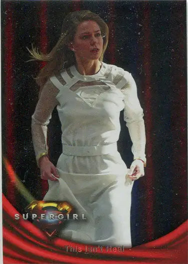Woman in a white superhero costume with Supergirl logo on Rainbow Foil Board Card 46