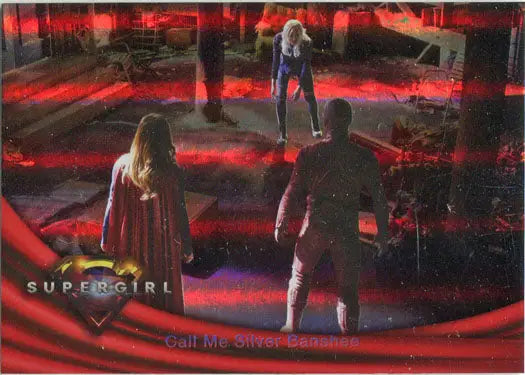 Scene from Supergirl on a red-lit stage featured on a Rainbow Foil Board card