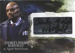 Autograph card featuring Charles Malik Whitfield in a dark suit with a blurred background